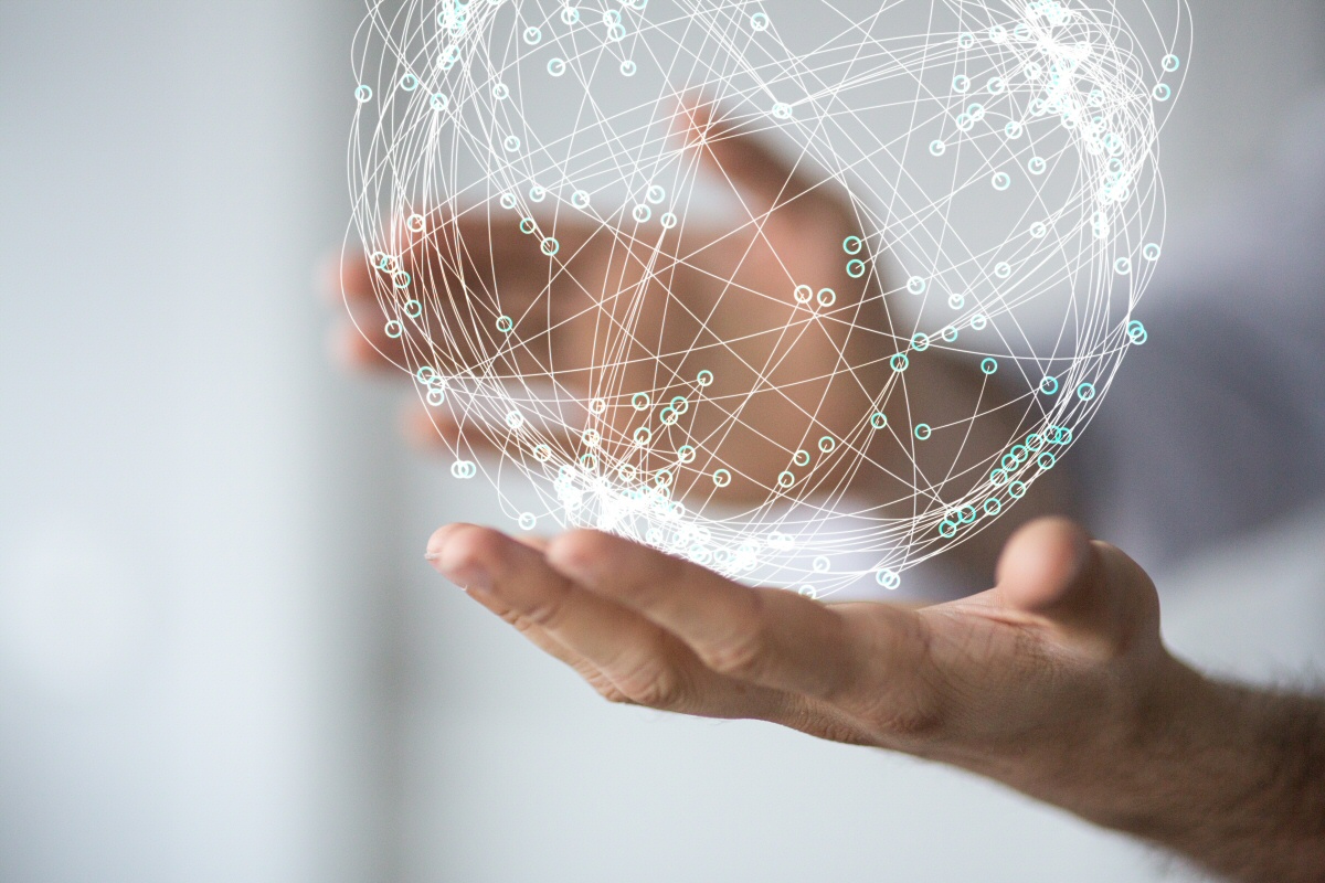 Photo of hands holding globe